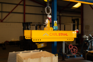 A photo showing the bespoke 2t H-lifting beam from it's side, the beam is branded with Carl Stahl